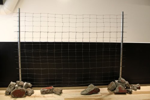 Messages of Hope and  Resistance, 2025, Metal, fence, rocks, cement, canvas, ribbon, ink, and wire,  72 by 96 by 12 inches