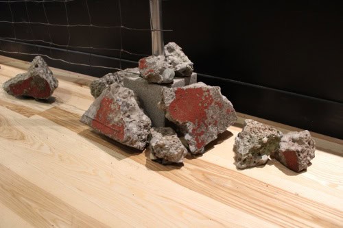 Messages of Hope and  Resistance, detail, 2025, Metal, fence, rocks, cement, canvas, ribbon, ink, and wire,  72 by 96 by 12 inches