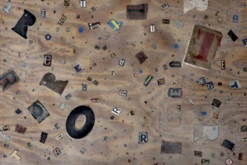 "Untitled (letters)" 2013, Encaustic paint, paper, cardboard wood and metal collage on wood, 30 by 42 inches