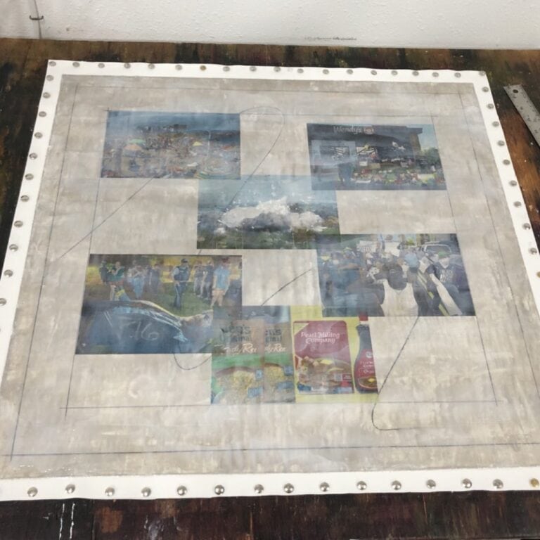 Collaged painting of news headlines in progress covered in wet matte medium.