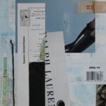 Collage art with paper from magazines, maps and metal.