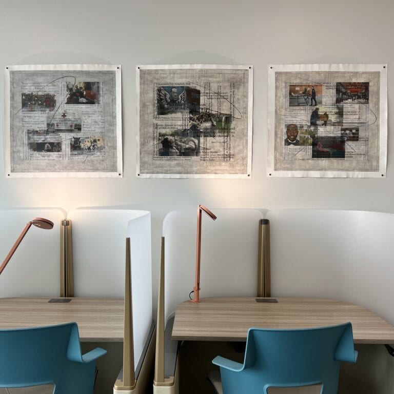 Three collage paintings by artist Sam Marroquin, hanging above study desks at the University of California.