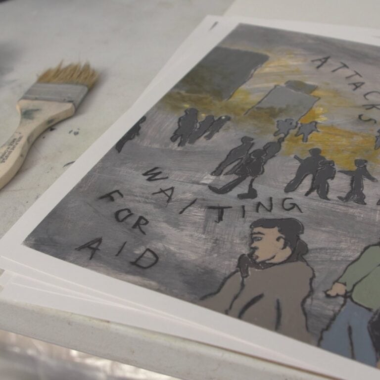 Abstracted painting of people, buildings and fire in the distance next to a paint brush, by artist Sam Marroquin.